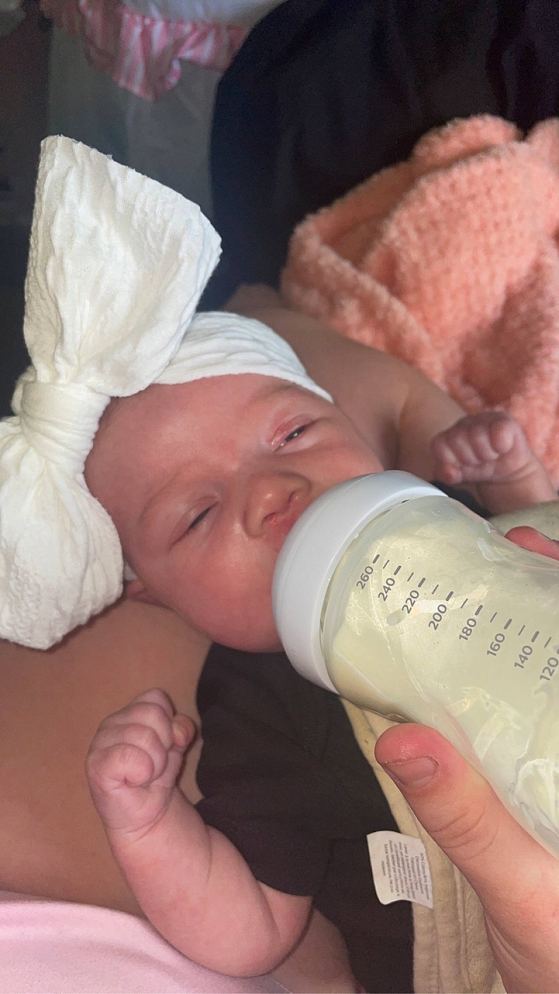 Marcella is registered to the contest to win money with this photo: baby, baby_products, baby_sleeping, baby_toddler_clothing, bottle, comfort, drink, drinking, drinkware, eyelash, finger, fluid, gesture, hand, infant_formula, nail, person, plastic_bottle, skin, thumb