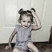 Brooklynn joined the competition — help win amazing prizes! child, girl, smile, hair_buns, bracelet, carpet, door, indoor, sitting, playful, cute, young, happy, casual_clothing, portrait, fun, light_skin, floor, accessory, room
