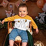 Grégory participe au concours pour gagner de l'argent avec cette photo : baby, bodypart, chair, clothing, couch, face, finger, fungus, furniture, hand, head, jeans, pants, person, photography, plant, portrait, sitting, sphere, toy