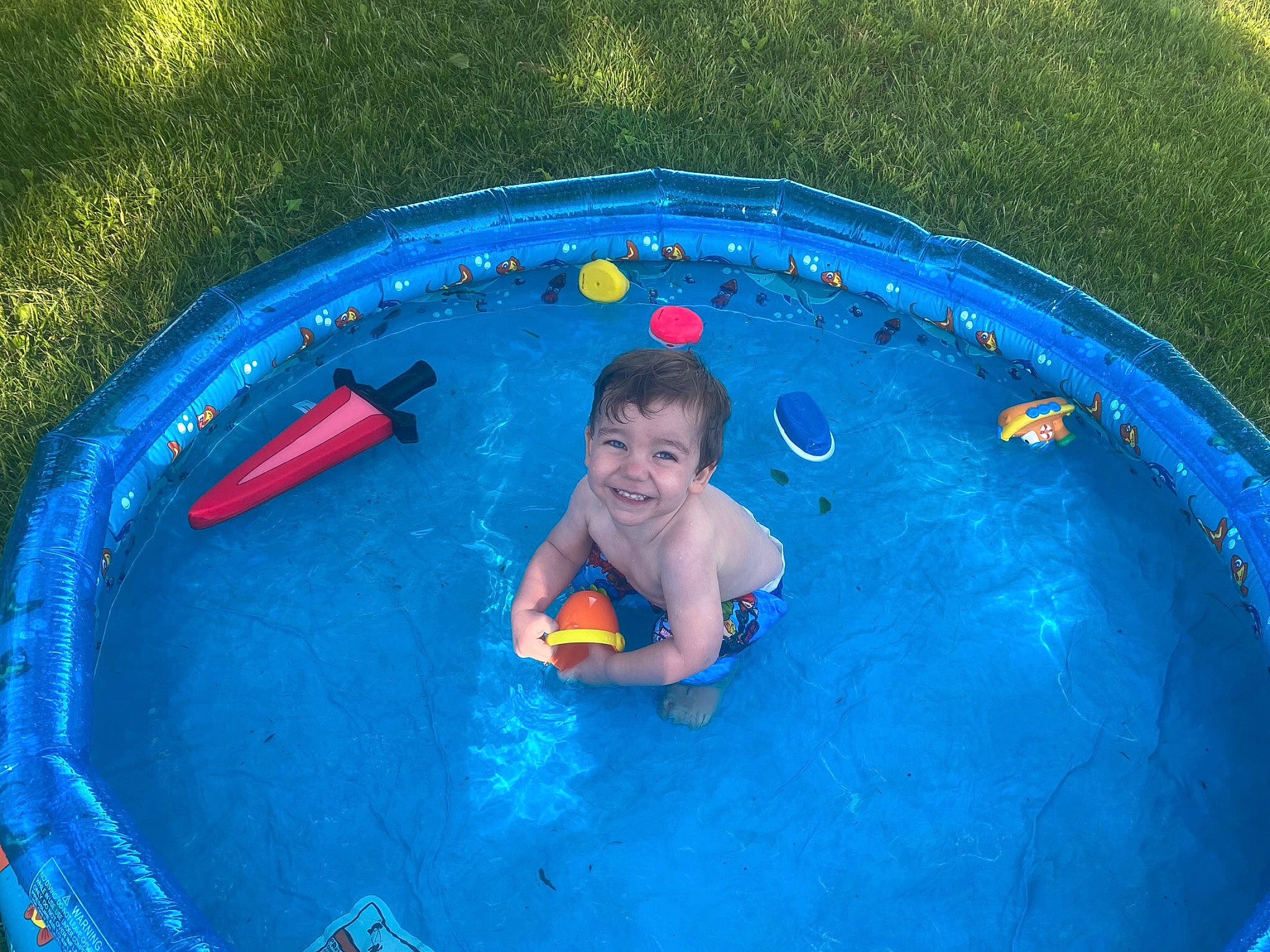 Zeke is registered to the contest to win money with this photo: baby_products, child, fun, joy, leisure, person, play, product, recreation, summer, swimming_pool, toddler, vacation, water