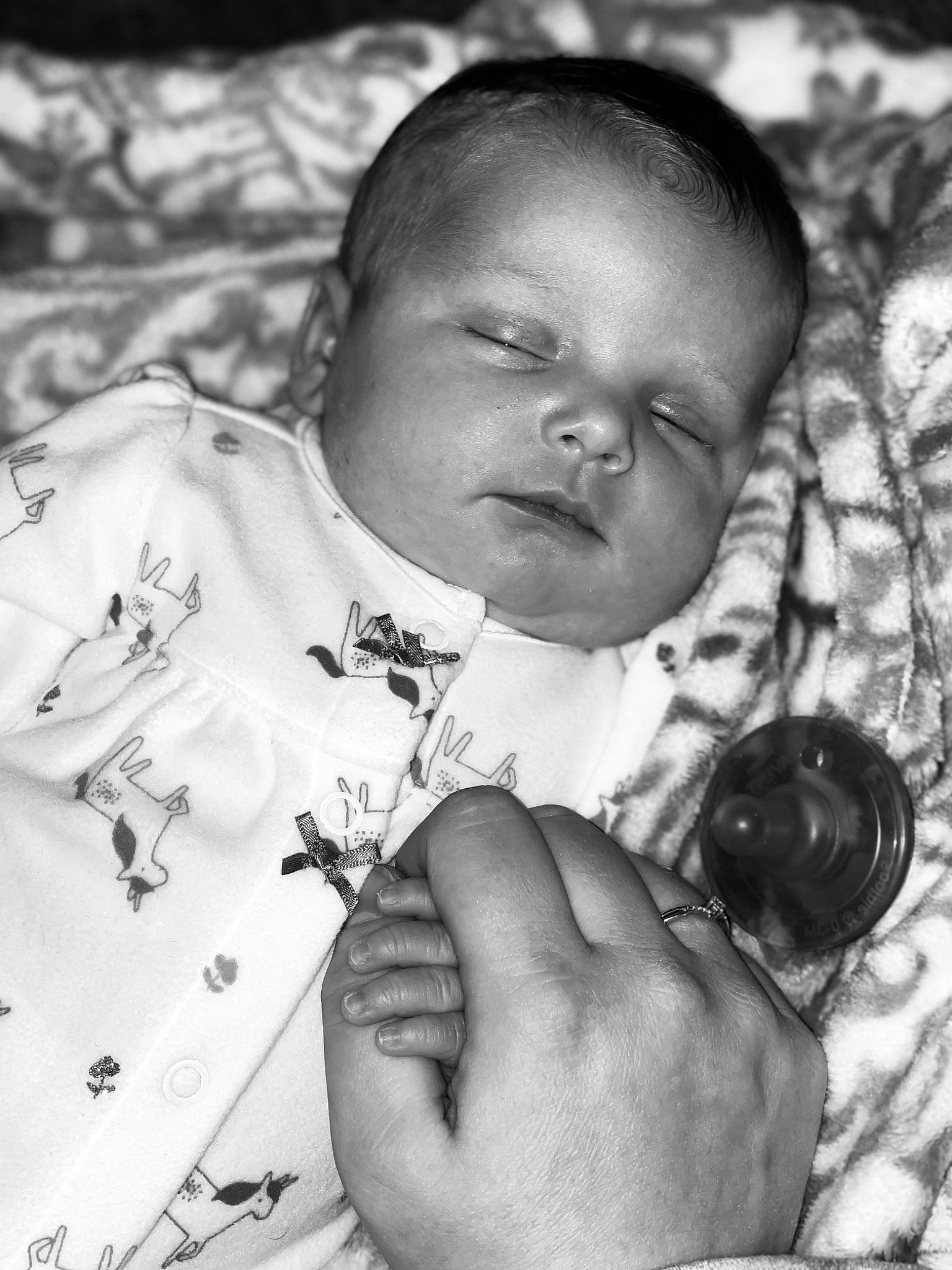 Octavia Jordyn is registered to the contest to win money with this photo: arm, baby, black, black_and_white, cheek, eye, eyebrow, finger, flash_photography, gesture, hand, happy, human_body, iris, lip, mouth, nose, person, photograph, skin