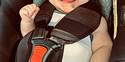 Ezio participe au concours pour gagner de l'argent avec cette photo : baby, car_seat, smiling, tongue_out, infant, safety_harness, cute, child, seat_belt, happy, cheeky, skin, hand, leg, clothing, indoor, portrait, person, closeup, doodle