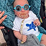 Ezio participe au concours pour gagner de l'argent avec cette photo : baby, sunglasses, pacifier, stroller, blanket, plush_toy, hand, clothing, person, infant, cute, blue, white_shirt, outdoor, comfort, child, baby_toy, soft_texture, relaxing, sunlight