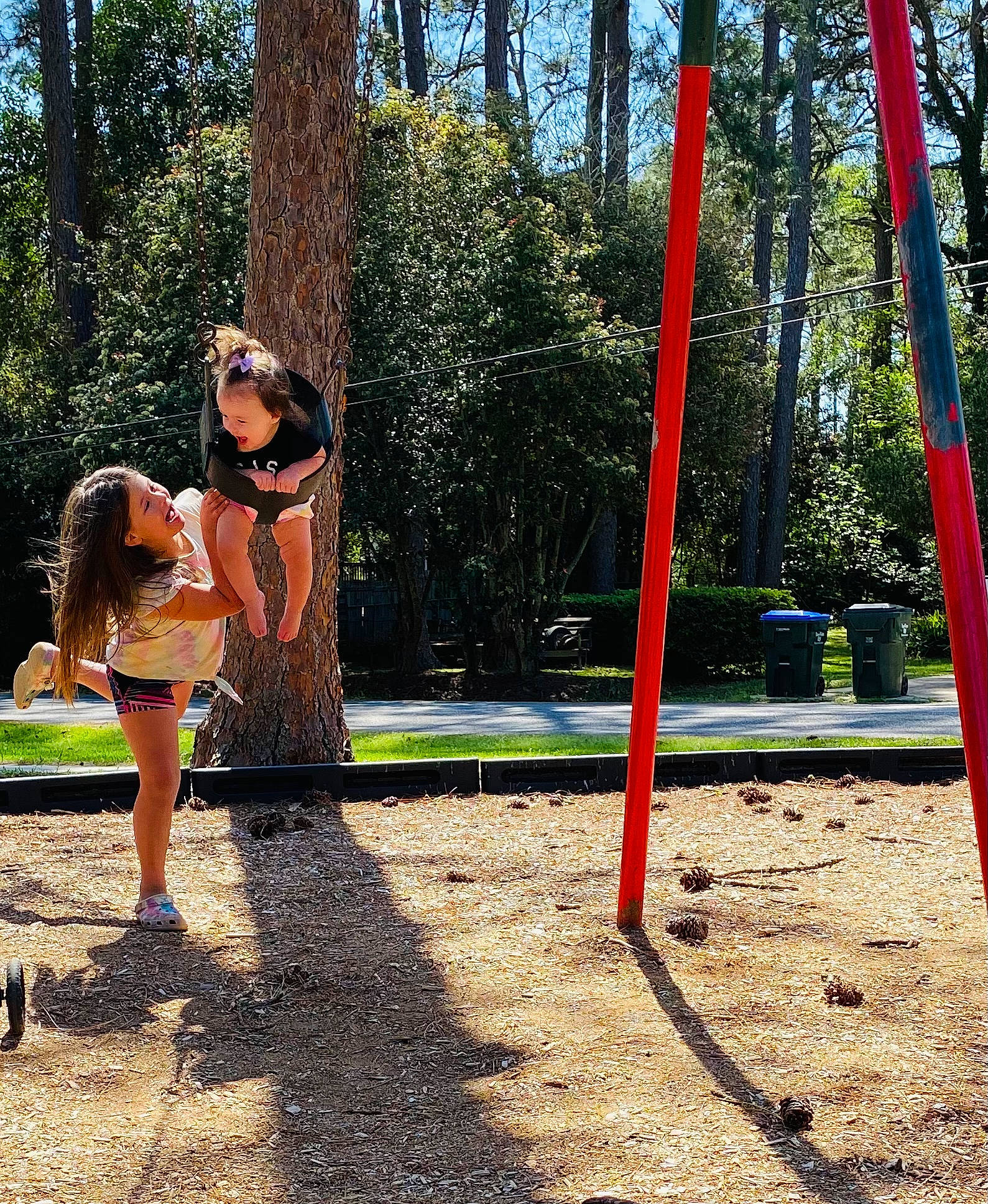 Annika joined the competition — help win amazing prizes! city, fun, gesture, grass, handbag, happy, leisure, luggage_and_bags, outdoor_play_equipment, people_in_nature, person, plant, playground, pole, recreation, shade, soil, tints_and_shades, tree, waist