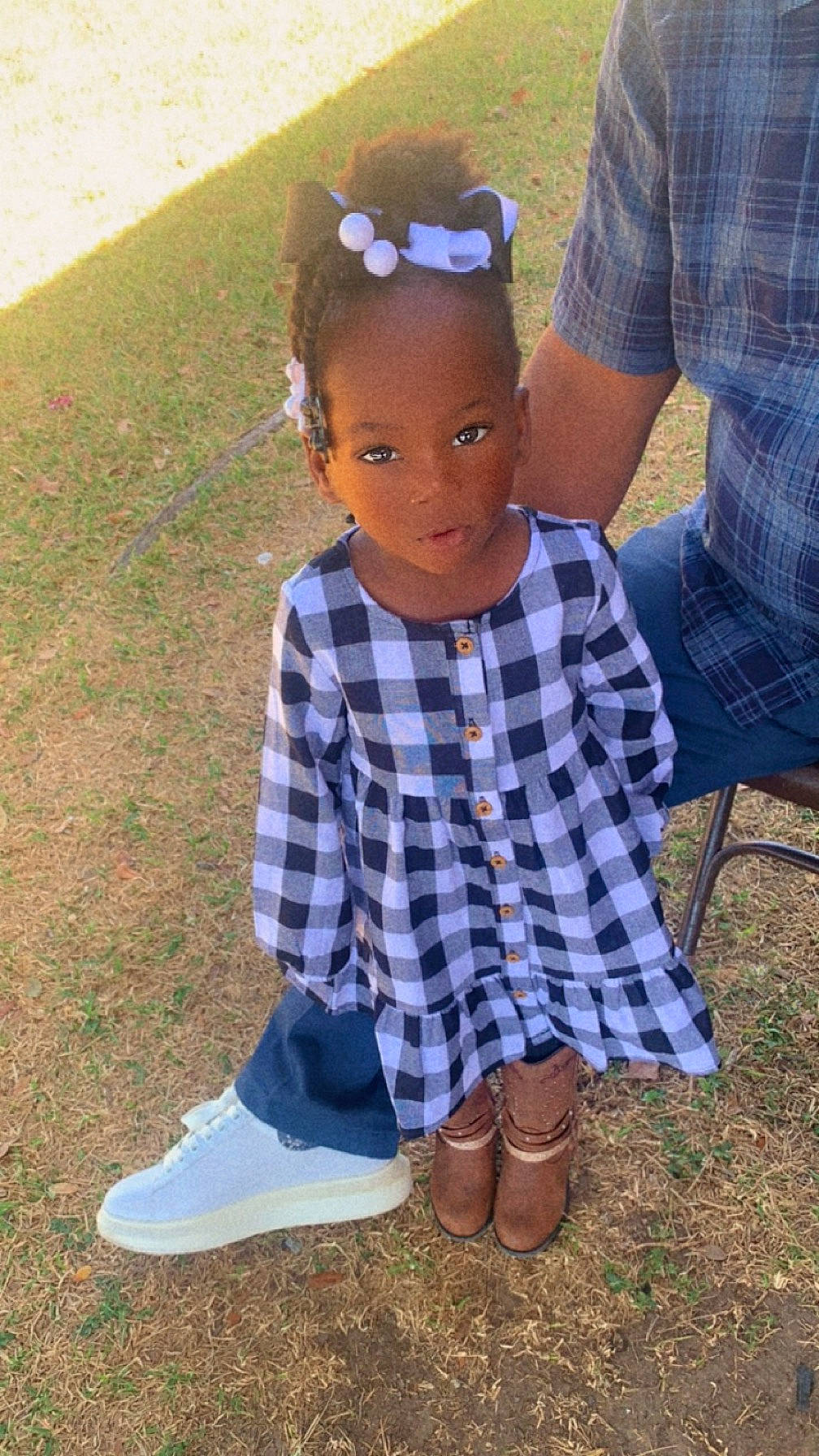 Janilah is registered to the contest to win money with this photo: baby_toddler_clothing, child, denim, electric_blue, fashion_accessory, grass, hairstyle, pattern, people_in_nature, person, plaid, shadow, sitting, sleeve, soil, tartan, toddler, toy, waist