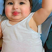 Muhammad joined the competition — help win amazing prizes! baby, child, tongue, white_tank_top, arm_raised, cheeks, face, skin, eyes, hair, blanket, fabric, soft, cute, expression, lying_down, indoors, infant, smile, playful