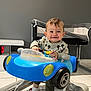 Mylan a rejoint le concours — aidez-le/la à gagner de superbes lots ! toddler, baby, child, toy_car, walker, smiling, happy, indoor, floor, mickey_mouse, clothing, socks, crib, furniture, modern, playtime, person, head, face, legs