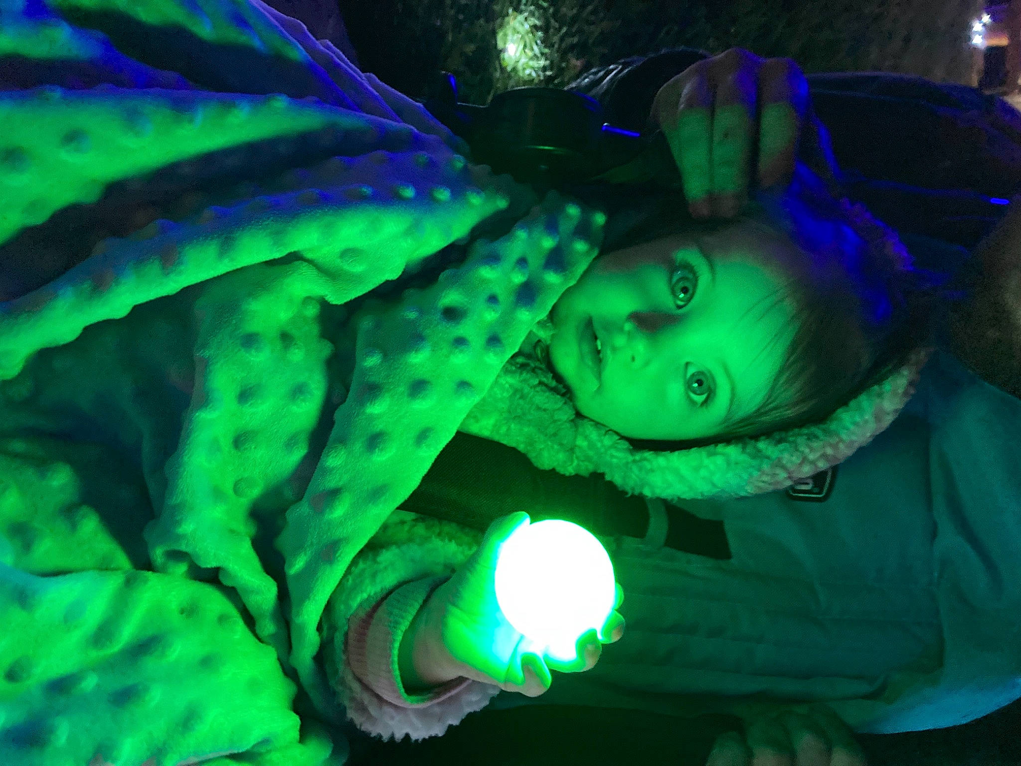 Kaylea is registered to the contest to win money with this photo: art, electric_blue, event, fictional_character, fun, grass, green, light, organism, person, terrestrial_plant, tree, visual_effect_lighting, water