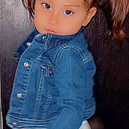 Viola is registered to the contest to win money with this photo: child, toddler, girl, pigtails, denim_jacket, patterned_skirt, door, indoor, portrait, eyes, face, smile, pose, hair, cute, young_child, little_girl, fashion, buttons, studio_style