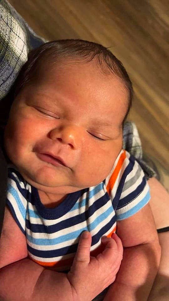 Kamari is registered to the contest to win money with this photo: baby, baby_toddler_clothing, cheek, child, close_up, comfort, eye, eyebrow, eyelash, finger, grass, happy, iris, lip, mouth, nose, person, skin, sleeve, thumb