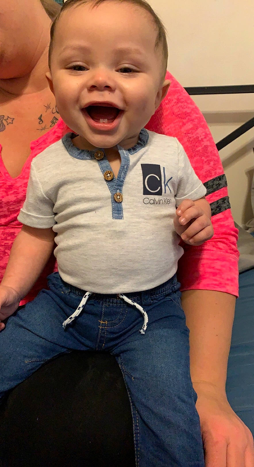 Lyric is registered to the contest to win money with this photo: baby, belt, cheek, chin, clothing, cool, denim, facial_expression, fun, gesture, happy, lip, nose, person, pink, skin, sleeve, smile, standing, t_shirt