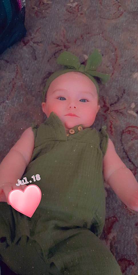 Zoe is registered to the contest to win money with this photo: beauty, carmine, cheek, child, chin, doll, fashion_accessory, fun, human_body, iris, lip, magenta, nose, person, pink, plastic, sitting, skin, sleeve, toy