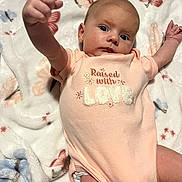 Cierra joined the competition — help win amazing prizes! baby, infant, onesie, blanket, butterfly, laying_down, raised_arm, cute, child, face, expression, soft_texture, fabric, pink, white, pattern, person, newborn, portrait, indoor