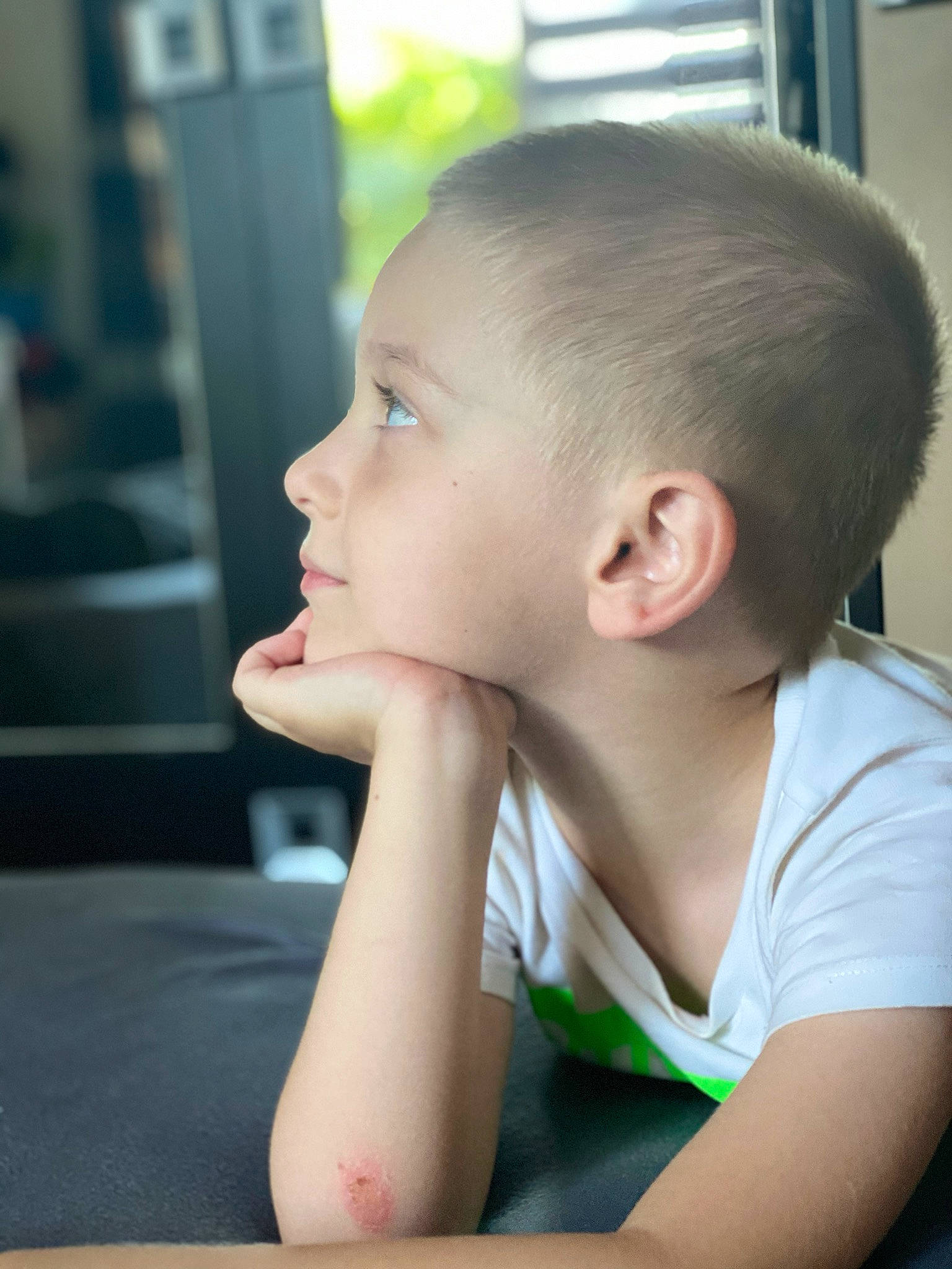 Ianis joined the competition — help win amazing prizes! arm, buzz_cut, caesar_cut, child, crew_cut, ear, elbow, eyelash, fun, happy, leisure, neck, person, portrait_photography, room, sitting, t_shirt, table, toddler, vacation