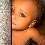 Ahyokaa is registered to the contest to win money with this photo: baby, child, face, peeking, curious, couch, earring, eyes, eyelashes, skin, hair, indoor, portrait, closeup, expression, infant, young_child, soft_light, texture, furniture