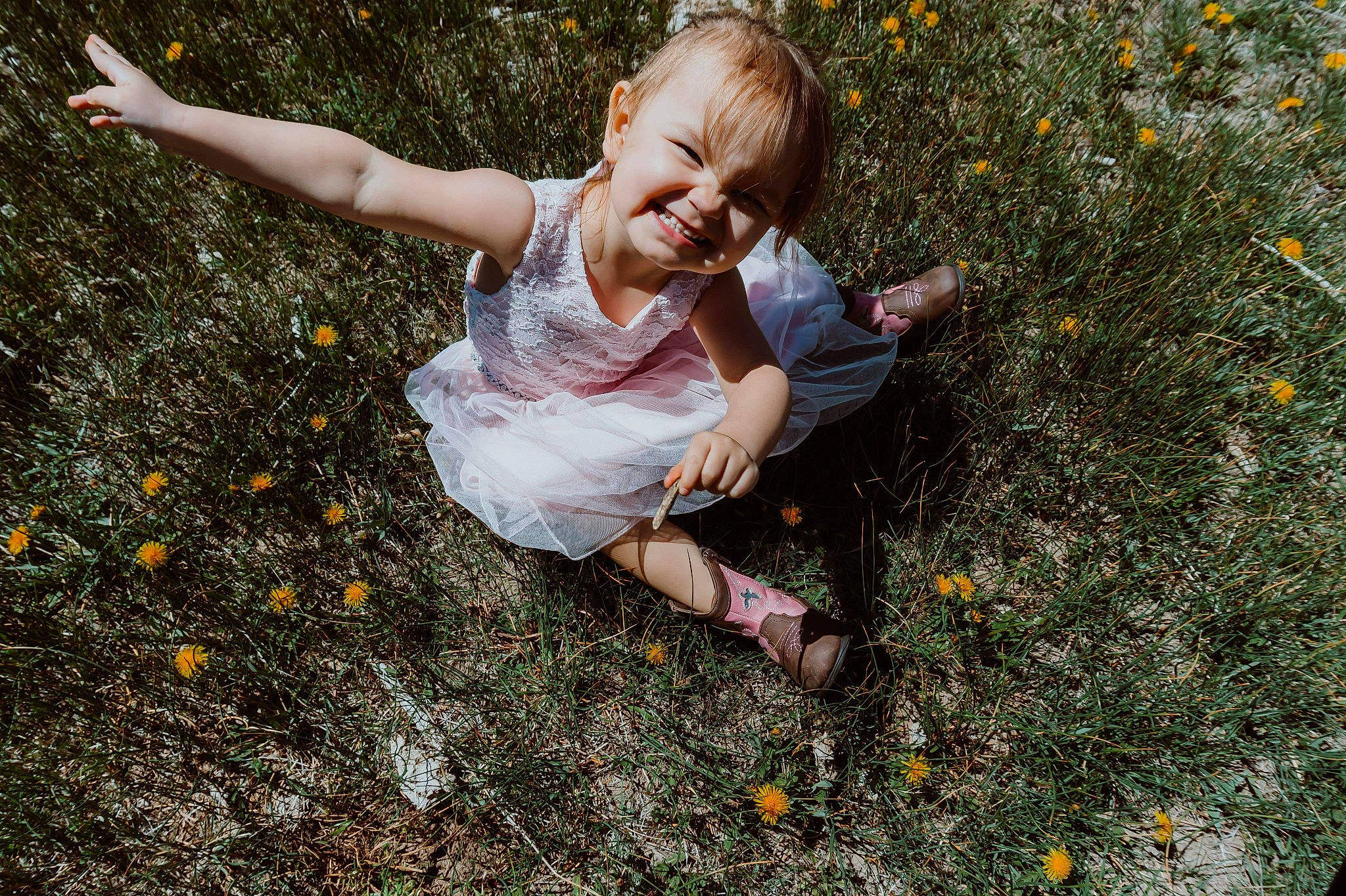 Xayah is registered to the contest to win money with this photo: arm, botany, dress, finger, flower, gesture, grass, hair, hand, happy, head, joy, leaf, leg, people_in_nature, person, petal, plant, smile, sunlight