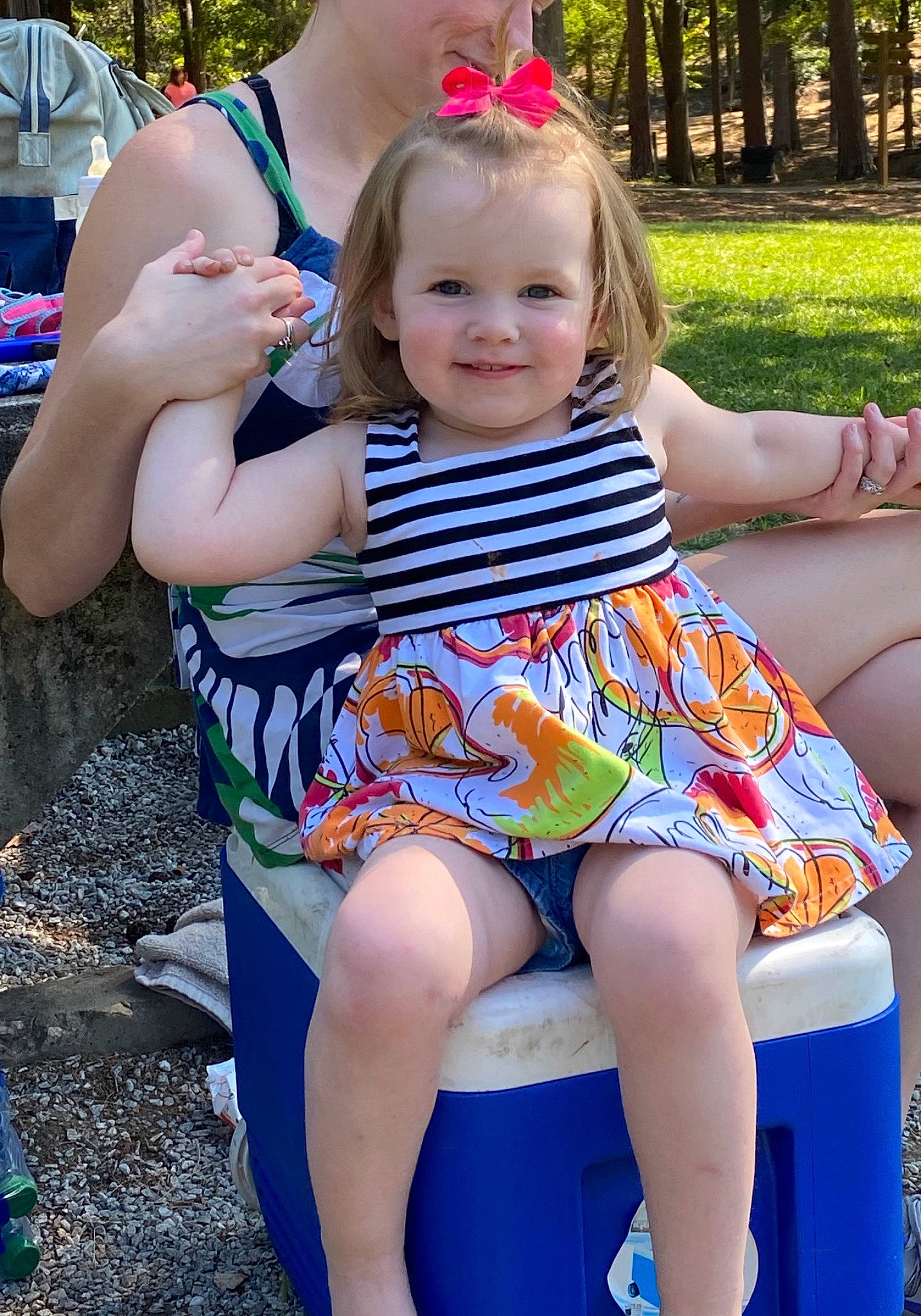 Olivia is registered to the contest to win money with this photo: baby, child, fun, grass, joy, leg, leisure, person, play, playground, public_space, recreation, sitting, style, summer, thigh, toddler, vacation