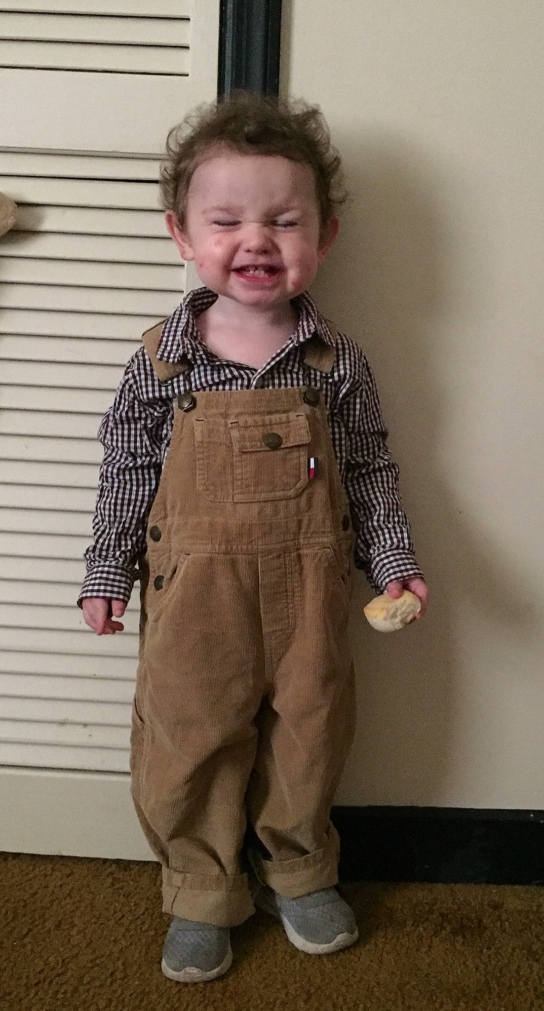 Garrett is registered to the contest to win money with this photo: child, clothing, joy, outerwear, overall, person, sleeve, standing, toddler