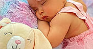 Sophia is registered to the contest to win money with this photo: baby, sleeping, infant, portrait, pink, flower_headband, tutu, dress, plush_toy, bunny, blanket, pastel, cozy, bed, lying_down, peaceful, closed_eyes, cuddling, nursery, photography