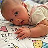baby, infant, child, portrait, lying_down, face, eyes, curious, indoor, blanket, bed, clothing, pink, white, hands, arm, patterned, colorful, closeup, photography