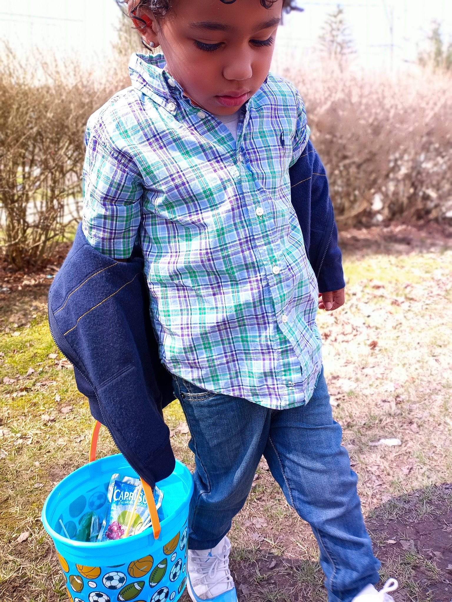 Avion joined the competition — help win amazing prizes! basket, blue, bucket, child, electric_blue, face, fun, grass, headwear, jeans, leaf, pattern, people_in_nature, person, photograph, plaid, plant, sleeve, sneakers, soil