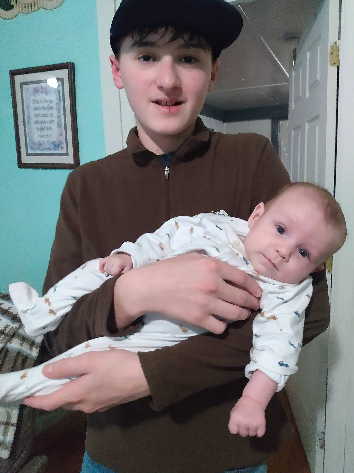 baby, baseballcap, bodypart, cap, clothing, face, finger, hand, hat, head, longsleeve, newborn, pants, people, person, photoframe, photography, portrait, shirt, sleeve