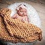 baby, blanket, child, cozy, cushion, cute, floor, headband, indoor, infant, knit, newborn, peaceful, pink, portrait, relaxing, sleeping, soft_lighting, white, wooden_floor