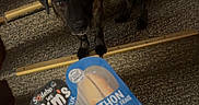 Taki participe au concours pour gagner de l'argent avec cette photo : dog, stairs, hand, packaged_food, indoor, carpet, wood_paneling, brindle, pet, animal, food_package, yellow, person, curious, looking_up, snack, holding, floor, step, human