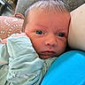 Mackenzie is registered to the contest to win money with this photo: adult, baby, blanket, child, close_up, clothing, couch, cozy, cuddling, eyes, face, family, indoor, infant, looking_at_camera, newborn, parent, photography, portrait, sleeve