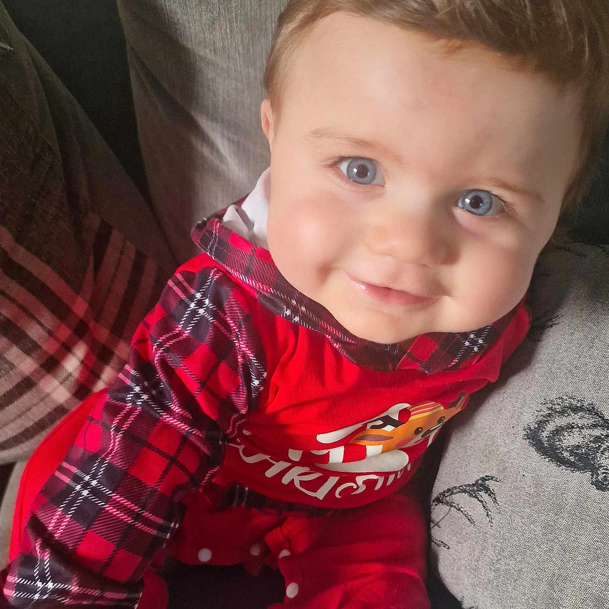 Zakk joined the competition — help win amazing prizes! baby, chair, clothing, coat, couch, cushion, face, furniture, happy, head, homedecor, indoors, pajamas, pants, person, photography, portrait, shirt, sitting, smile