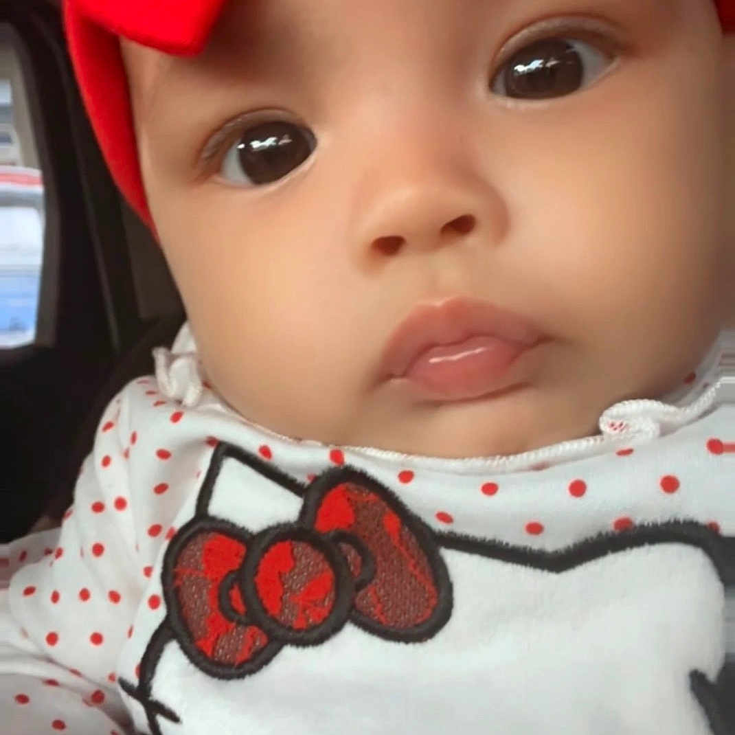 Miyanni joined the competition — help win amazing prizes! baby, child, closeup, face, headband, red_bow, hello_kitty, polka_dots, cute, infant, indoors, clothing, hand, portrait, young_child, adorable, soft_lighting, expression, looking_at_camera, skin