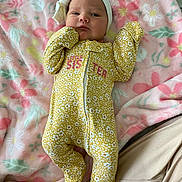 Everleigh is registered to the contest to win money with this photo: baby, bed, blanket, bonnet, cap, clothing, couch, face, furniture, glove, hat, head, newborn, pajamas, person, photography, portrait, quilt, sleeping, yawning