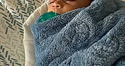 Kaisen joined the competition — help win amazing prizes! baby, blanket, pacifier, sleeping, infant, cushion, pattern, blue, soft, cozy, face, head, child, wrapped, resting, indoors, peaceful, closeup, person, comfort