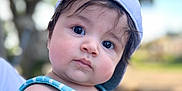 Elijah joined the competition — help win amazing prizes! baby, blue_striped_shirt, cap, child, closeup, curious, cute, daylight, expression, face, hat, headwear, infant, nature, outdoor, person, portrait, skin, summer_clothing, young_child