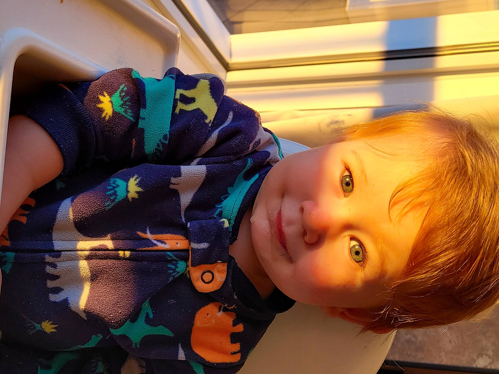 Logan a rejoint le concours — aidez-le/la à gagner de superbes lots ! baby, baby_toddler_clothing, brown_hair, eyebrow, eyelash, face, grass, happy, human_body, iris, leisure, lip, nose, pattern, person, plant, smile, textile, toddler, tree