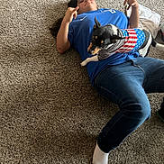 Astro is registered to the contest to win money with this photo: adult, animal, canine, clothing, dog, face, footwear, head, hosiery, jeans, male, pants, person, pet, photography, portrait, puppy, shoe, sock, t_shirt
