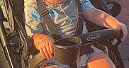 Jaziel is registered to the contest to win money with this photo: baby, casual_clothing, child, curly_hair, cute, daylight, expression, graco, outdoor, park, pavement, person, playful, seatbelt, shoes, stroller, summer, sunlight, toddler, young_child