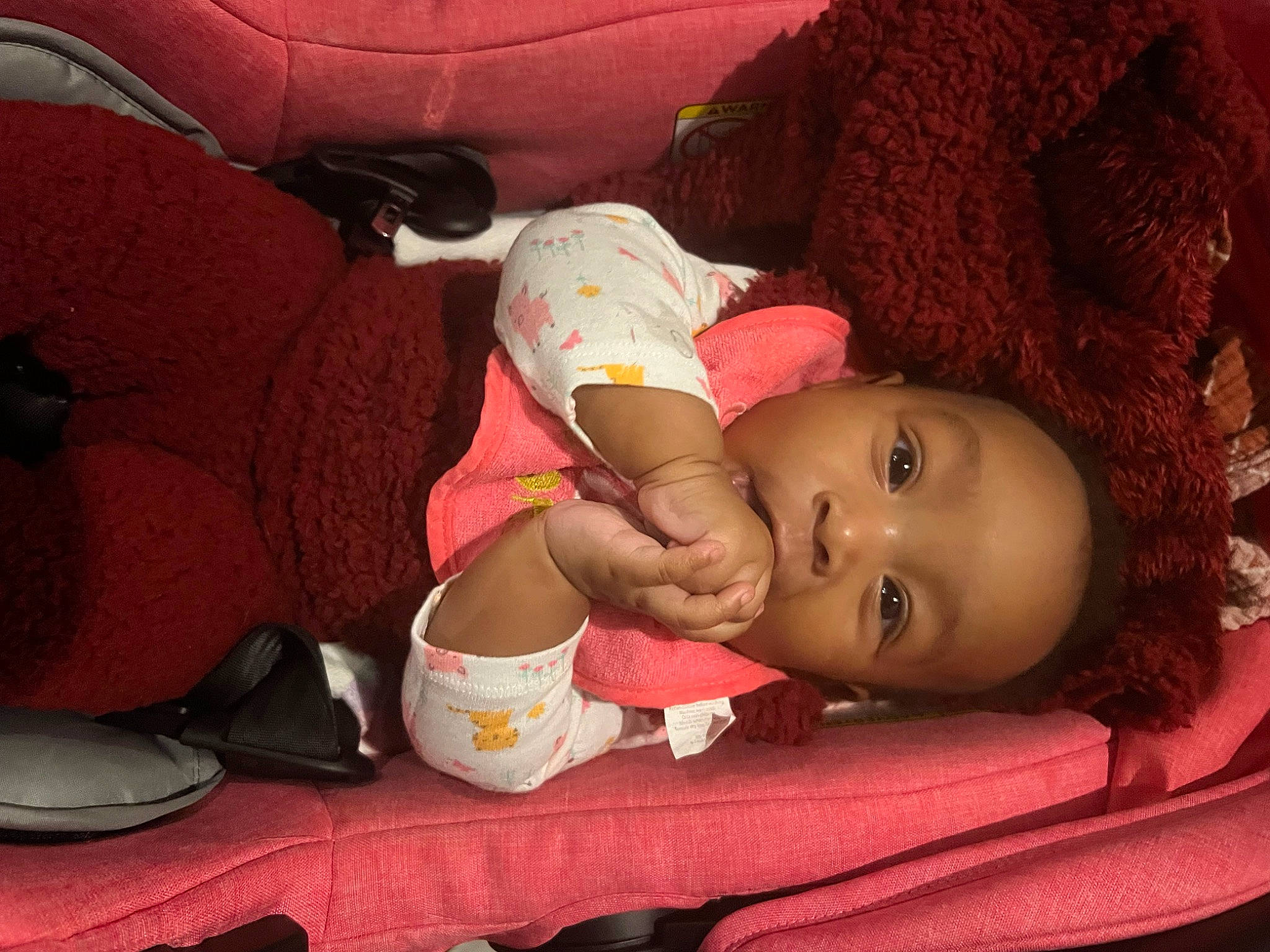 Kenna is registered to the contest to win money with this photo: baby, baby_products, baby_toddler_clothing, bedtime, carmine, cheek, child, comfort, face, fun, headgear, magenta, mouth, nose, person, red, room, sitting, skin, toddler