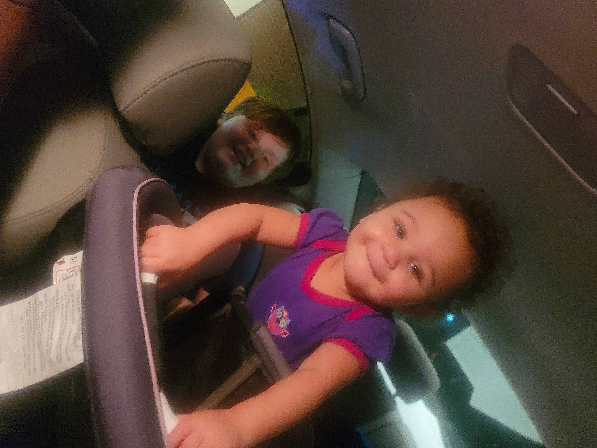 Avery is registered to the contest to win money with this photo: auto_part, automotive_design, automotive_exterior, black_hair, car_seat, child, comfort, elbow, family_car, fun, happy, head_restraint, joy, leisure, luxury_vehicle, motor_vehicle, mouth, person, smile, t_shirt