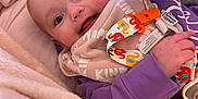Maisie is registered to the contest to win money with this photo: architecture, baby, bed, blanket, bodypart, building, clothing, face, finger, furniture, hand, happy, head, hospital, newborn, person, photography, portrait, quilt, smile