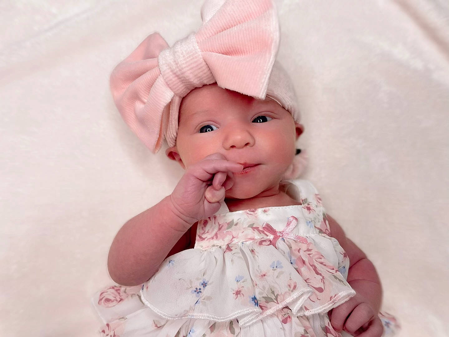 Khaleesi is registered to the contest to win money with this photo: baby, baby_toddler_clothing, cheek, chin, doll, dress, ear, eye, eyelash, hair_accessory, happy, head, headgear, headwear, lip, person, pink, skin, sleeve, toddler