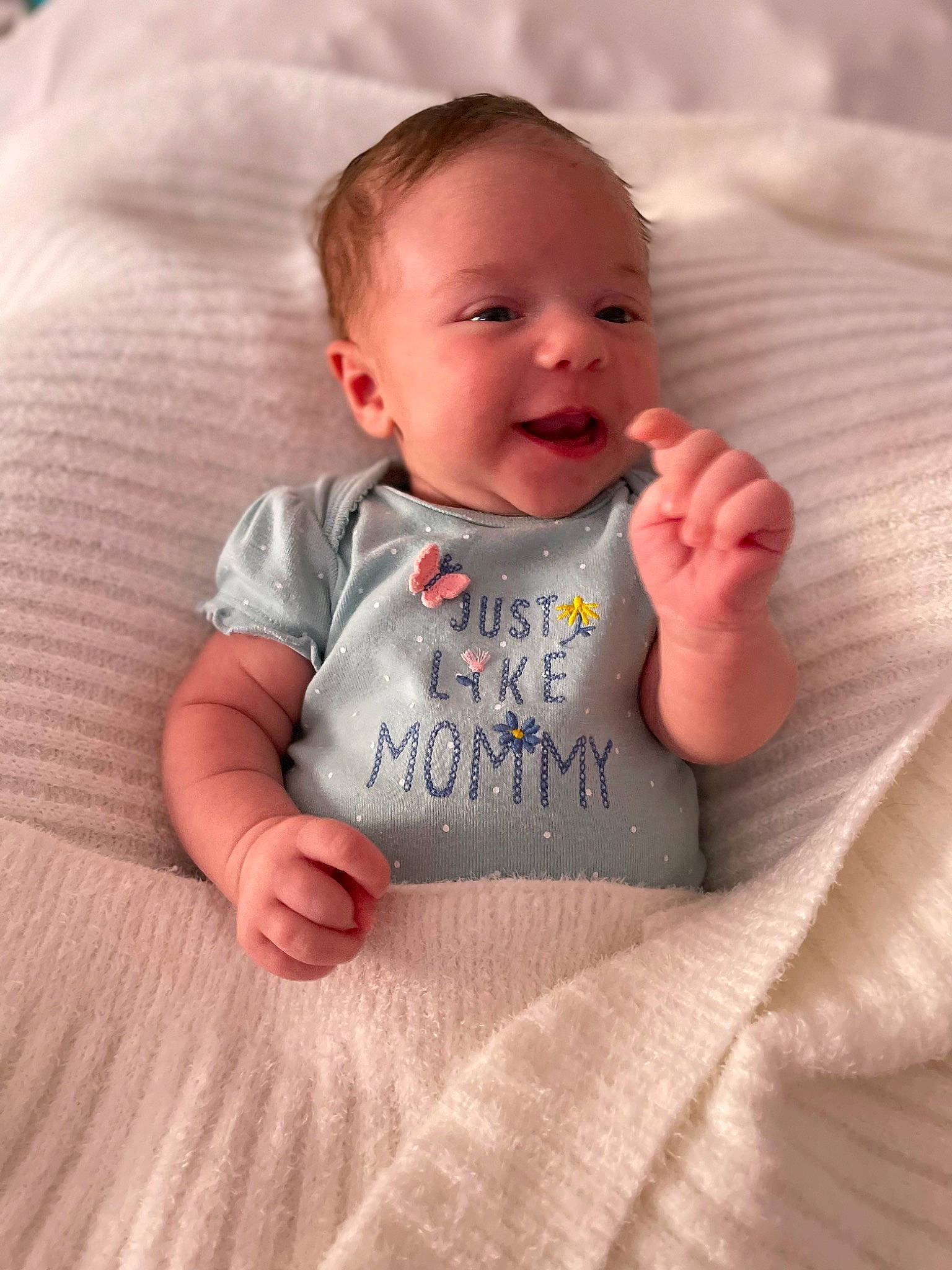 Khaleesi is registered to the contest to win money with this photo: arm, baby, baby_toddler_clothing, cheek, chin, comfort, eye, face, finger, hair, hand, head, iris, lip, mouth, nose, person, skin, sleeve, smile