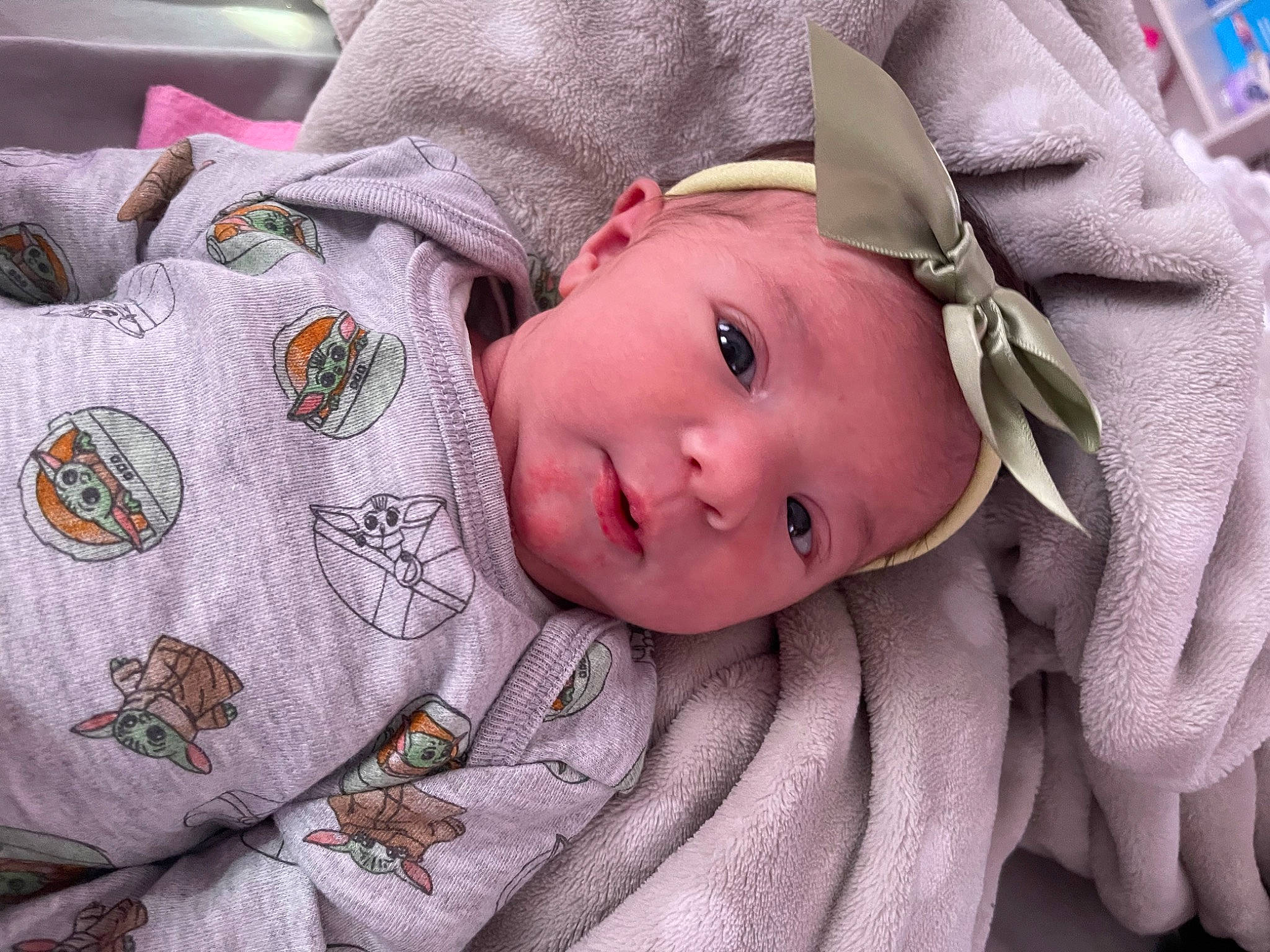 Khaleesi joined the competition — help win amazing prizes! baby, baby_products, baby_toddler_clothing, cheek, child, comfort, face, facial_expression, grass, headwear, linens, magenta, pattern, person, polar_fleece, product, skin, sleeve, textile, toddler