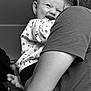 Tylia participe au concours pour gagner de l'argent avec cette photo : adult, arm, baby, black_and_white, child, clothing, cute, face, family, happy, holding, indoor, joy, laughing, pattern, person, portrait, sleeve, smile, young