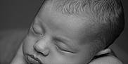 Tylia participe au concours pour gagner de l'argent avec cette photo : arms, baby, black_and_white, calm, child, close_up, cute, face, hair, hands, infant, lying_down, newborn, peaceful, portrait, resting, skin, sleeping, soft, texture