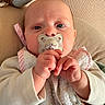 Jeanne participe au concours pour gagner de l'argent avec cette photo : baby, infant, pacifier, hands, face, closeup, blanket, cozy, indoor, child, cute, curious, soft, texture, clothing, portrait, young, comfort, resting, warm