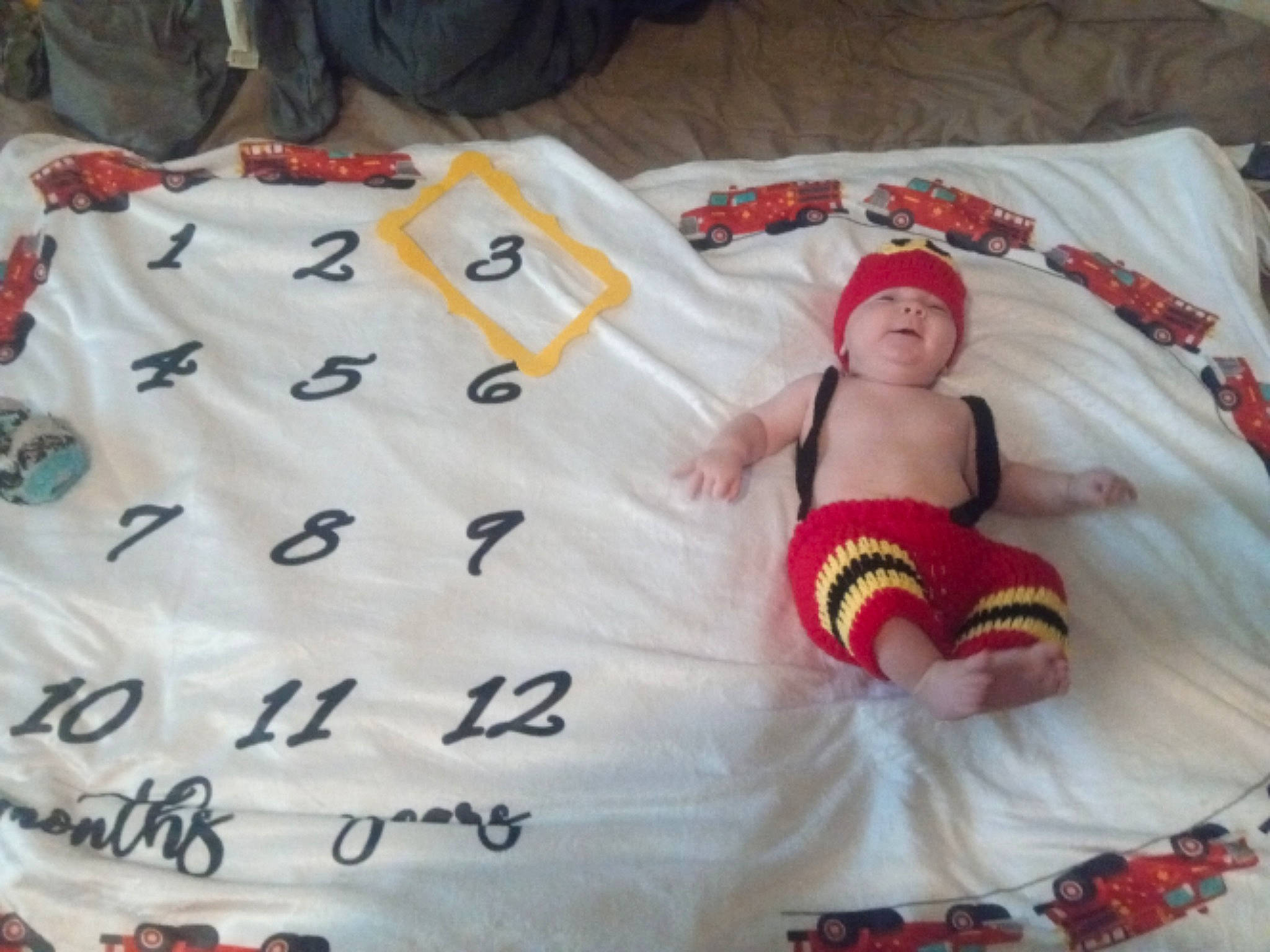 Austin joined the competition — help win amazing prizes! baby, baby_products, bed_sheet, blanket, child, headwear, linens, nap_mat, person, product, quilt, textile, toddler