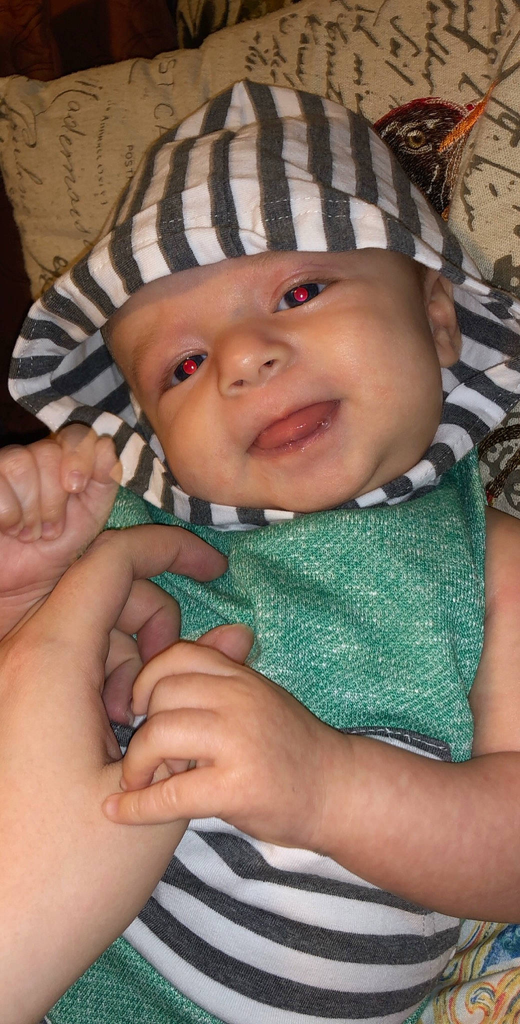 Jensen is registered to the contest to win money with this photo: beanie, bonnet, cap, cheek, child, eye, finger, girl, hand, hat, headgear, headwear, infant, knitting, mouth, nose, person, product, skin, smile