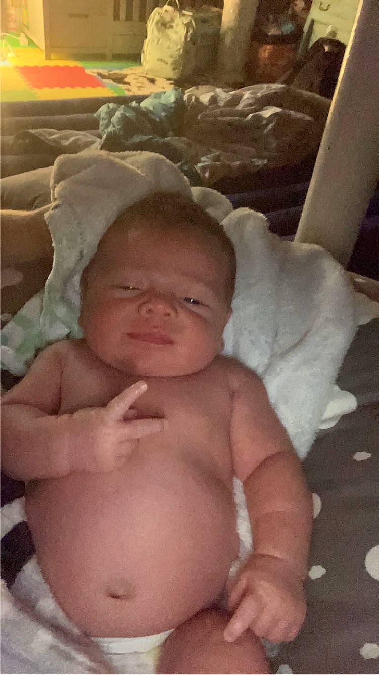 Kol joined the competition — help win amazing prizes! abdomen, baby, barechested, cheek, chest, child, comfort, finger, flesh, happy, human_body, linens, navel, person, sitting, skin, smile, stomach, thumb, toddler