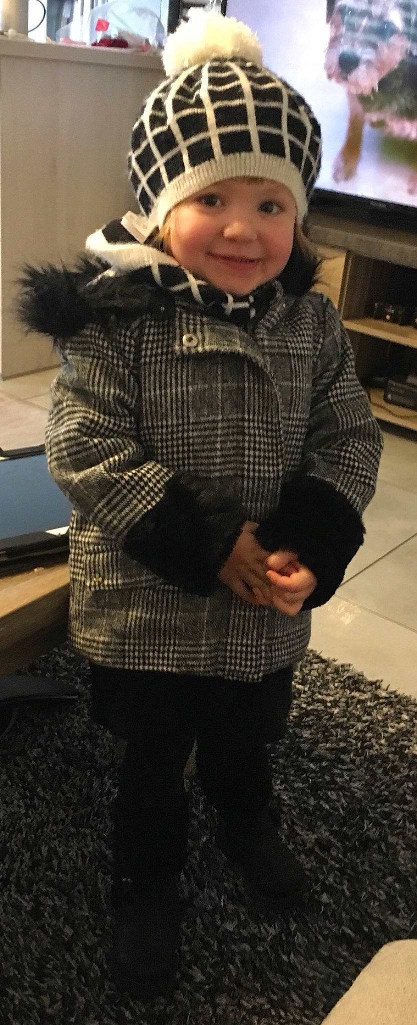 Alissa participe au concours pour gagner de l'argent avec cette photo : child, clothing, cool, design, fur, headgear, headwear, jacket, joy, outerwear, pattern, person, photography, plaid, sleeve, sweater, tartan, toddler, top